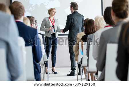 [[stock_photo]]: Rear View Of Group Of Diverse Business People Attending A Business Seminar In Office Building While