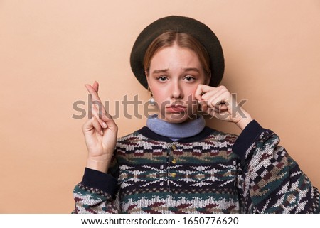 Stock fotó: Photo Of Pretty Unhappy Woman Crying With Fingers Crossed For Good Luck