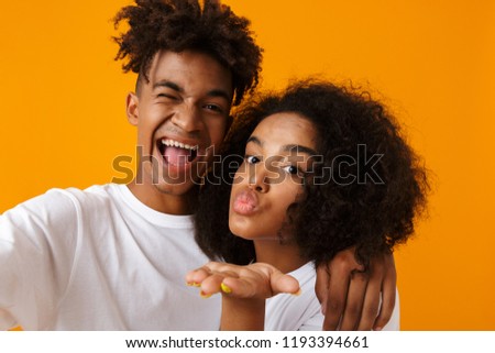 Stock foto: Young Cute African Couple Posing Isolated Over Beige Background Showing Thumbs Up Gesture Take A Sel