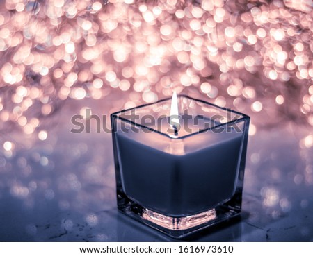 Stock foto: Blue Aromatic Candle On Christmas And New Years Glitter Backgrou