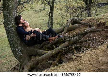 Foto stock: Image Of Young Brunette Asian Woman With Long Hair Talking On Ce