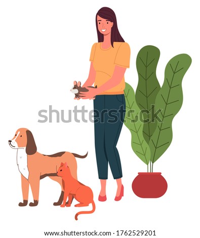 Stok fotoğraf: Young Woman Holding Hamster In Hands Orange Cat And Dog Standing Near Woman Love Animals