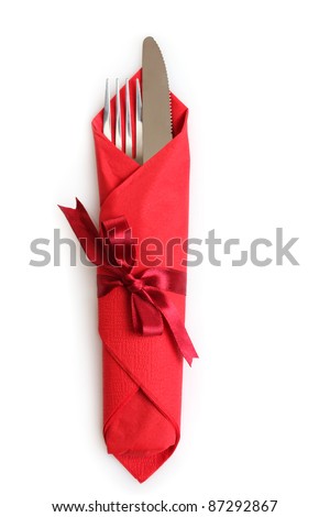 Foto d'archivio: Fork Spoon Knife And White Plate On Red Cloth Isolated On Whit