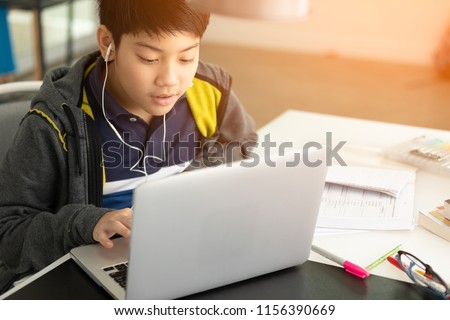 Stock photo: Boy Working On A Laptop