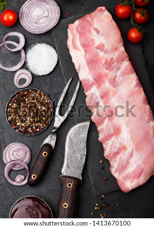 Foto stock: Fresh Raw Pork Ribs On Chopping Board And Vintage Hatchets On Wooden Background Pepper And Salt Sp