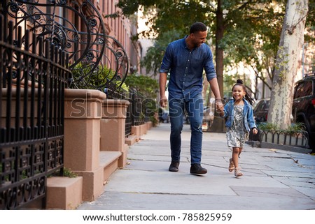 Сток-фото: Family Taking A Walk Down The Street