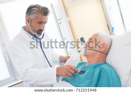 Stockfoto: Senior Man Using Medical Equipment For Inhalation With Respirato