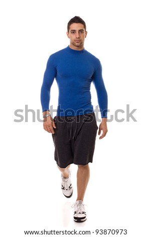 Foto stock: Athletic Young Man In A Blue Compression Shirt Studio Shot Over White