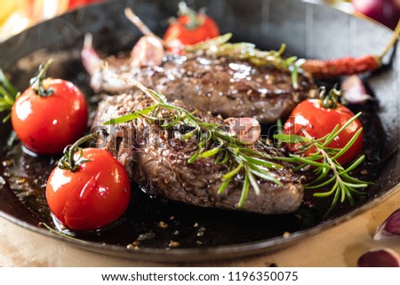 Stockfoto: Roasting Vine Tomatoes In A Pan