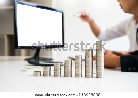 Сток-фото: Stacks Of Coins Person Pointing Writing Finance Goals On Compute