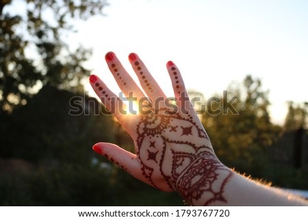 Stock photo: Young Woman With A Picture On The Hand Of Henna - Mehendi Drinks Coffee In The Morning On The Balcon