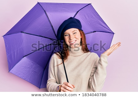 Foto stock: Happy Teenage Girl In Red Celebrating Triumph