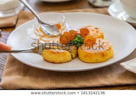 [[stock_photo]]: Sugar Covered Blueberries On Pancakes With Jam
