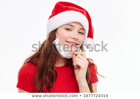 Stock photo: Funny Red Haired Girl In Christmas Cap With Gift Boxes