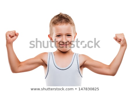Foto d'archivio: Smiling Sport Child Boy Showing Hand Biceps Muscles Strength