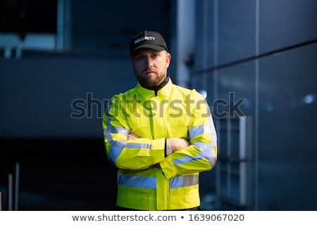 Zdjęcia stock: Male Security Guard Standing At The Entrance