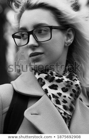 Zdjęcia stock: Serious Young Blonde Lady Walking Outdoors Looking Aside