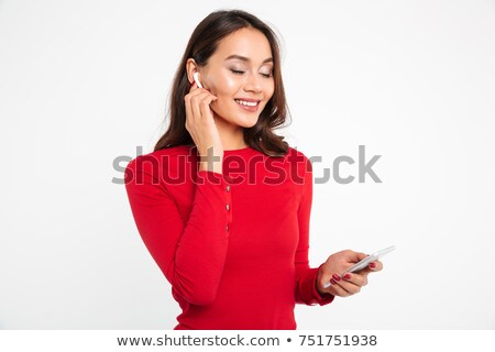Сток-фото: Portrait Of A Cheerful Pleased Asian Woman In Earphones
