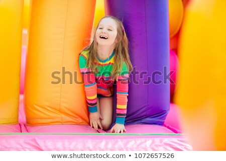 Stock photo: Children Bouncing On Trampoline