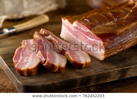 Foto stock: The Cut A Smoked Bacon On A Cutting Board