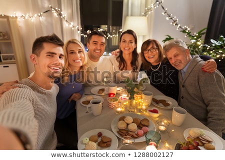 Stock fotó: Happy Family Taking Picture At Christmas Dinner