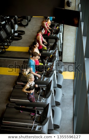 Stok fotoğraf: Top View At Young People Running On Treadmills In Modern Gym