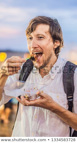 ストックフォト: Young Man Tourist On Walking Street Asian Food Market Vertical Format For Instagram Mobile Story Or