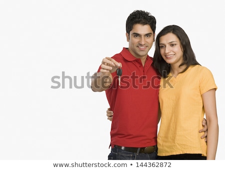 ストックフォト: Couple Holding Key In Front Of Cars