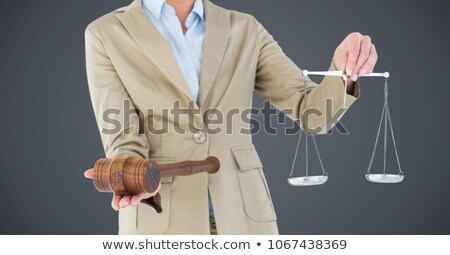 Zdjęcia stock: Female Judge Mid Section With Scales And Gavel Against Grey Background