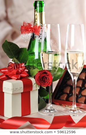 [[stock_photo]]: Close Up Of Champagne Gift Candies And Red Roses