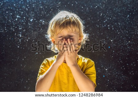 Zdjęcia stock: Allergy To Dust Boy Sneezes Because He Is Allergic To Dust Dust Flies In The Air Backlit By Light