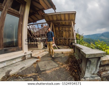 Stock fotó: Man Tourist In Abandoned And Mysterious Hotel In Bedugul Indonesia Bali Island Bali Travel Concep