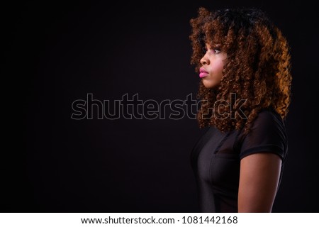 Foto stock: Profile Of Beautiful African Young Woman With Long Curly Hair