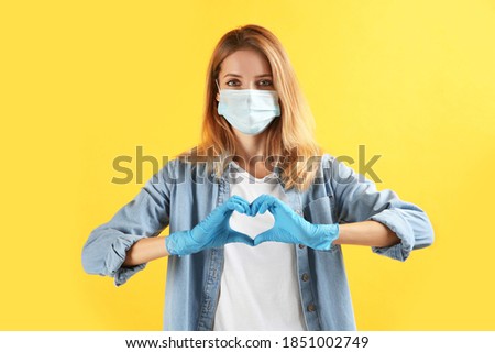 Stock photo: Young Female Doctor With Protective Gloves Examining Radiograph