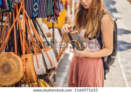 Foto stock: Woman Traveler Choose Souvenirs In The Market At Ubud In Bali Indonesia Banner Long Format