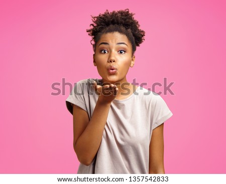 Stock photo: Young Beautiful African American Woman Blowing A Kiss