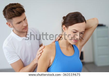 Stock foto: Physiotherapist Stretching The Injured Womans Neck