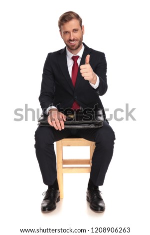 Stock fotó: Seated Businessman Makes The Ok Thumbs Up Sign While Presenting