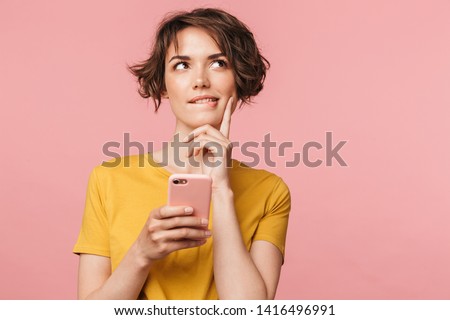 ストックフォト: Thinking Thoughtful Young Woman Posing Isolated Over Pink Background Wall