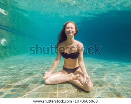 Stock fotó: Young Woman In Black Bikini In Yoga Position Underwater In Diving Aquarium Full Body Shot Front Vi