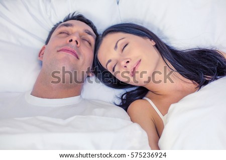 [[stock_photo]]: Smiling Young Man Laying On A Pillow In Bed