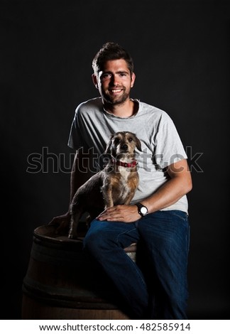 Stockfoto: Three Wine Producers Smiling In Cellar