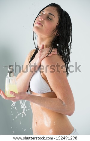 Zdjęcia stock: Beautiful Girl Showering Holding Glass Bottle With Shower Gel