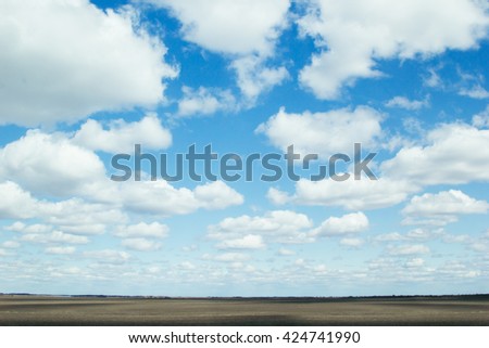 ストックフォト: Blue Sky Background With Soft Silky Clouds Strip Yellow Field And Road