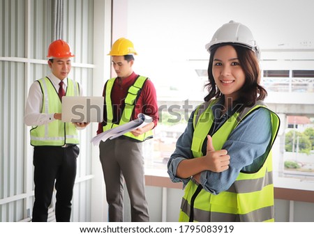 Stockfoto: Two Professional Male And Female Engineers Working And Discuss Wi