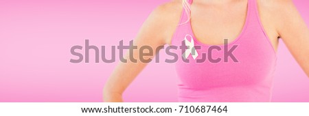 ストックフォト: Mid Section Of Standing Woman For Breast Cancer Awareness With Ribbon On White Background