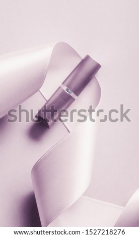 Stock fotó: Luxury Lipstick And Silk Ribbon On Blush Purple Holiday Backgrou