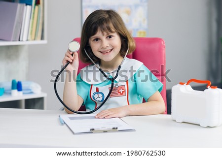 Stock photo: Indoor Shot Of Adorable Small Preschool Girl Dressed In Fashionable Outfit Huggs Jack Russel Terrie