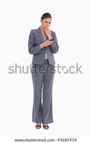 Stock fotó: Tradeswoman Being Shocked By Text Message Against A White Background