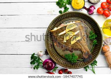 Foto d'archivio: Baked Flounder On A Plate With Vegetables The Restaurant Signature Dish Isolated On A White Backgro